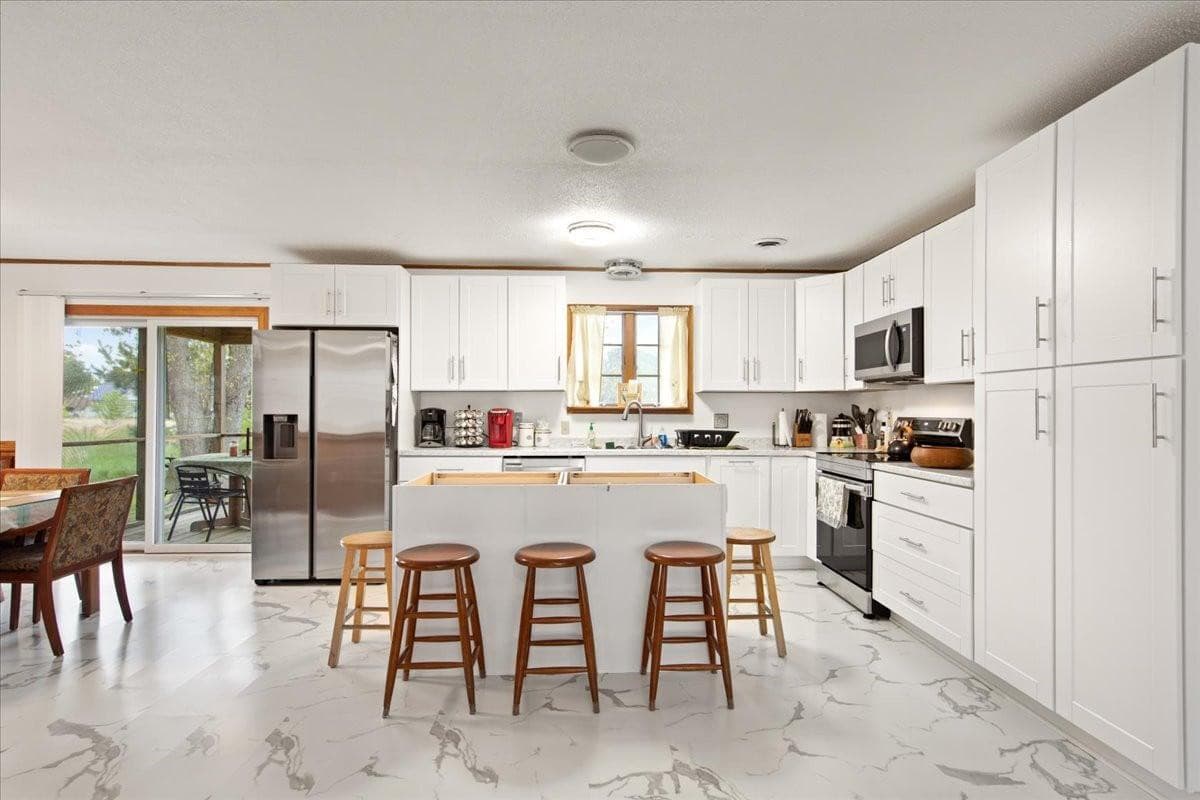 The new kitchen with all-new appliances was recently completed (2022).  The butcher block counter on the Island was not in place yet when the picture was taken.  