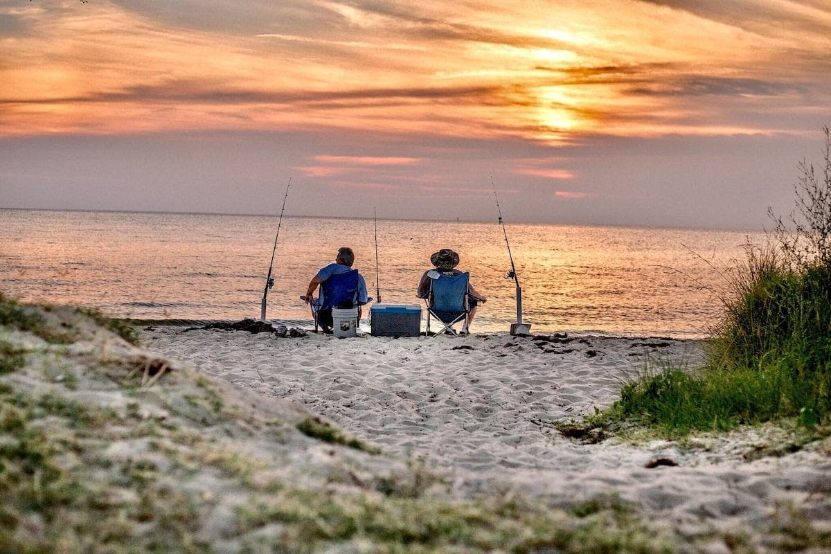 Just a short walk over the bridge to the beach from the house where you can relax like these guests.